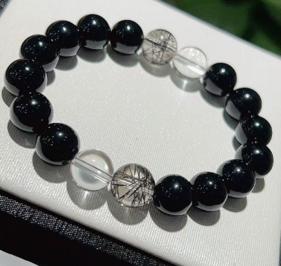 The Midnight Sentinel bracelet featuring Black Obsidian, Black Rutilated Quartz, and Clear Quartz beads - Image 2